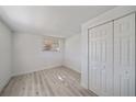 Bright bedroom features fresh paint, new floors and a window with blinds at 5713 Saint Louis Ave, Sarasota, FL 34233