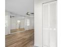 Bright living room with hardwood floors and mirrored wall at 6091 Coral Way, Bradenton, FL 34207