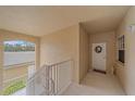 Condo hallway with access to unit and stairs at 6334 Grand Oak Cir # 201, Bradenton, FL 34203