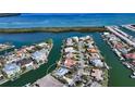 Aerial view of waterfront home with private dock and canal access at 721 Old Compass Rd, Longboat Key, FL 34228