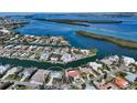 Aerial view of waterfront home with private dock and canal access at 721 Old Compass Rd, Longboat Key, FL 34228