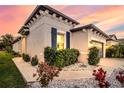 Well-manicured landscaping surrounds this lovely home's exterior at 8501 Starlight Loop, Parrish, FL 34219