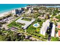 Aerial view showing complex near beach and ocean at 100 The Esplanade N # 6, Venice, FL 34285