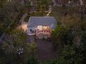 Aerial view of a single-story house with a pool and lush landscaping at 1021 99Th Nw St, Bradenton, FL 34209