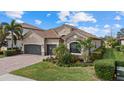 Spacious two-car garage and nicely landscaped front yard at 13013 Ramblewood Trl, Bradenton, FL 34211