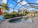 Inviting screened pool and spa with comfortable lounge chairs at 13013 Ramblewood Trl, Bradenton, FL 34211