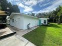 View of the house's side, showing a storage area at 1703 Center Rd, Terra Ceia, FL 34250