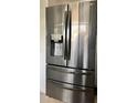 Stainless steel refrigerator with French doors and bottom freezer at 2040 Pine Ridge Dr, Clearwater, FL 33763