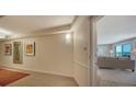 Bright condo entryway with a view into the living room at 2295 Gulf Of Mexico Dr # 115S, Longboat Key, FL 34228