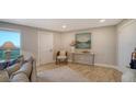 Condo living room featuring neutral decor and hardwood floors at 2295 Gulf Of Mexico Dr # 115S, Longboat Key, FL 34228