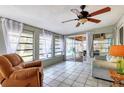 Relaxing sunroom with tiled floors, ample natural light, and access to the backyard at 2503 Bispham Rd, Sarasota, FL 34231