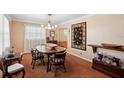 Formal dining room with wooden table and dark brown carpet at 2519 17Th W Ave, Bradenton, FL 34205