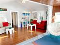 Bright and airy living room with hardwood floors and comfy seating at 4019 Worcester Rd, Sarasota, FL 34231