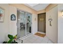 Inviting entryway with glass door leading to dining area at 4728 Sand Trap Street E Cir, Bradenton, FL 34203