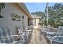 Relaxing patio area with comfortable seating and a view of the golf course at 4728 Sand Trap Street E Cir, Bradenton, FL 34203