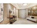 Elegant entryway with high ceilings, marble floors, and stylish decor at 50 Central Ave # 17Phc, Sarasota, FL 34236