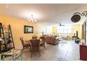 Charming dining area with glass table and wicker chairs at 501 Spring Lakes Blvd # 501, Bradenton, FL 34210