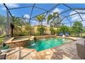 Inviting pool and spa with a screened-in enclosure at 5116 Tivoli Run, Bradenton, FL 34211