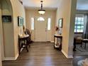 Light and airy entryway with wood-look floors at 5134 241St E St, Myakka City, FL 34251