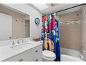 Bright bathroom with bathtub, toilet, and white vanity at 5348 Royal Palm Ave # 5348, Sarasota, FL 34234