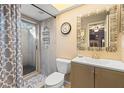 Bathroom with shower, toilet, vanity, and decorative mirror at 5348 Royal Palm Ave # 5348, Sarasota, FL 34234