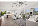 Bright living room with white sofas and open floor plan at 5351 Moeller Ave, Sarasota, FL 34233