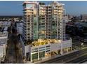 Luxury highrise building at dusk, showcasing the city lights at 540 N Tamiami Trl # 802, Sarasota, FL 34236