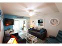 Cozy living room featuring a gray sofa and coastal decor at 5891 Welcome Rd # I6, Bradenton, FL 34207