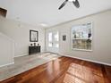 Bright foyer with hardwood floors, a view to the double front doors and staircase at 6150 42Nd Street E Cir, Bradenton, FL 34203