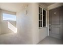 Bright hallway with light walls and tiled floors at 12320 Wellen Golf St # 401, Venice, FL 34293