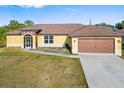 Single-story house with a brown garage door and screened porch at 1790 S Biscayne Dr, North Port, FL 34287