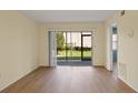Living room with sliding glass doors leading to a patio at 25100 Sandhill Blvd # 102, Punta Gorda, FL 33983