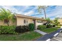 Attractive exterior of condo with well-maintained landscaping at 2782 Woodgate Ln # 18, Sarasota, FL 34231