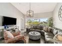 Spacious living room featuring hardwood floors, modern lighting, and comfortable seating at 7254 Cedar Hollow Cir, Bradenton, FL 34203