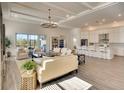 Open living space with large sectional sofa, tile floors, and high ceilings at 8066 Redonda Loop, Bradenton, FL 34202