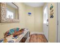 Bright entryway with a console table and a seashell mirror at 821 Evergreen Way, Longboat Key, FL 34228