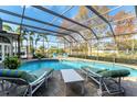 Inviting pool and patio area with lounge chairs and a view of lush landscaping at 8348 9Th Avenue Nw Ter, Bradenton, FL 34209