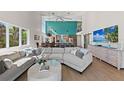 Open floor plan featuring living room connected to the kitchen and high ceilings at 140 N Casey Key Rd, Osprey, FL 34229