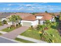 Aerial view of house, showing driveway, landscaping, and neighborhood at 14608 Derna Ter, Bradenton, FL 34211