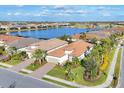 Aerial view of community, showcasing lakefront property and neighborhood at 14608 Derna Ter, Bradenton, FL 34211