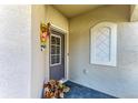 Inviting front entrance with a decorative door and accents, plus decorative flowers at 15917 Clear Skies Pl, Lakewood Ranch, FL 34211