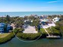 Aerial view of waterfront property with canal access at 18 N Casey Key Rd, Osprey, FL 34229