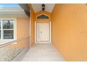 Covered entryway with tiled flooring leading to the front door at 433 Scarlet Sage, Punta Gorda, FL 33955