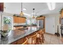 Spacious kitchen with granite countertops and stainless steel appliances at 4419 Mangrove Point Rd, Bradenton, FL 34210
