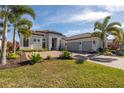 Beautiful home with a three-car garage and lush landscaping at 4745 Benito Ct, Bradenton, FL 34211