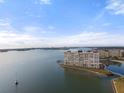 Condo building on a peninsula with water views and boat at 4775 Cove Cir # 202, St Petersburg, FL 33708