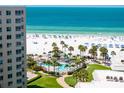 Stunning view from condo of the beach, ocean, and resort-style pool at 5916 Midnight Pass Rd # 103, Sarasota, FL 34242