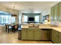Modern kitchen with stainless steel appliances and island at 7709 River Preserve Dr, Bradenton, FL 34212