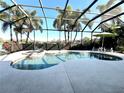Inviting pool and spa area with a screened enclosure at 7709 River Preserve Dr, Bradenton, FL 34212