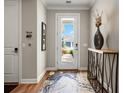 Light-filled entryway showcasing a modern console table and view to backyard at 116 Daylily Blvd, Nokomis, FL 34275